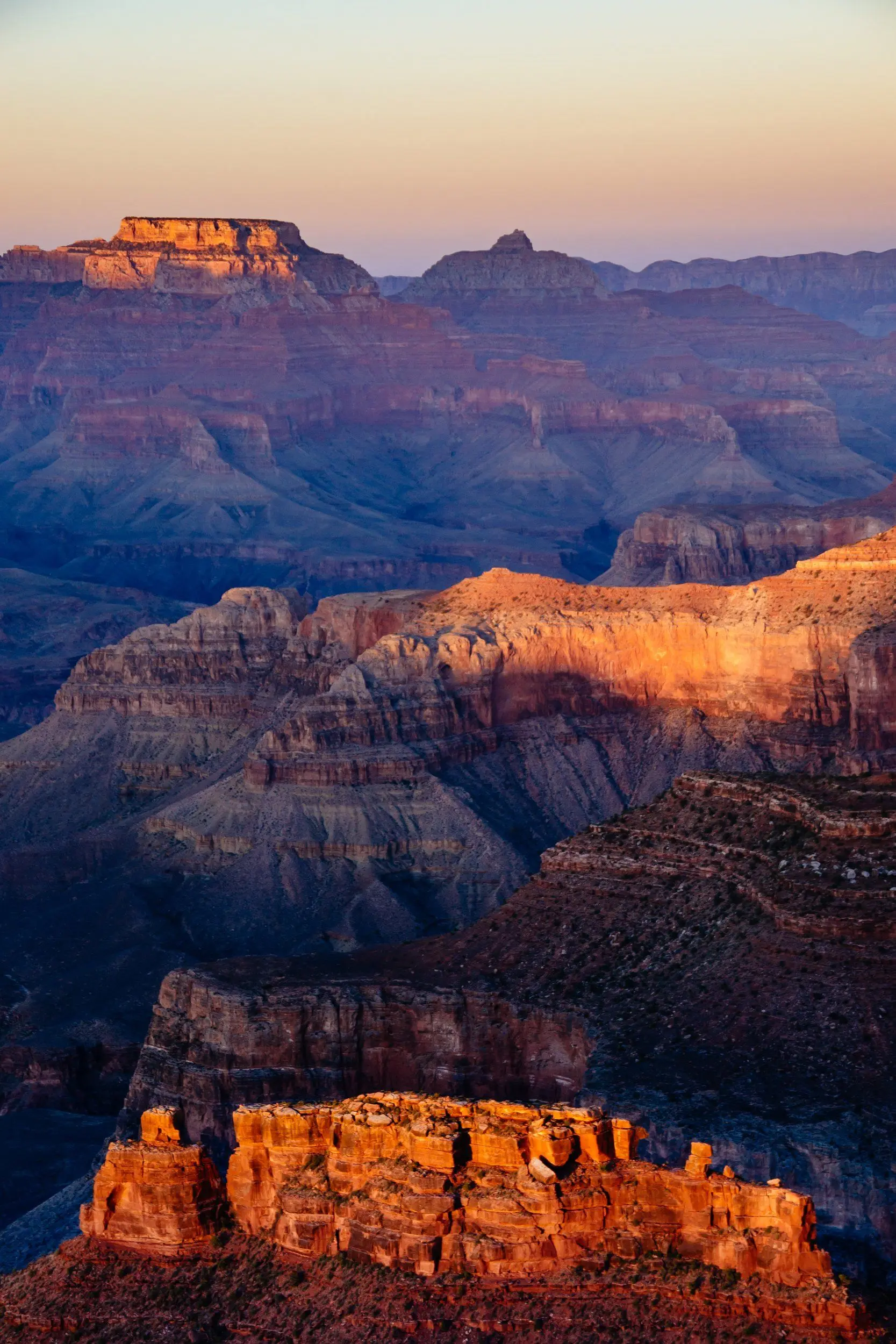 Rich gradients of warm to cool colors of the Grand Canyon seen from Hopi Point during sunset.